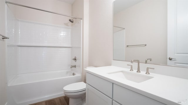 full bathroom featuring vanity, wood-type flooring, shower / tub combination, and toilet