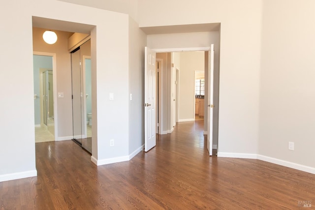 spare room with dark hardwood / wood-style flooring