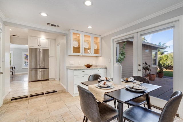 dining room with visible vents, recessed lighting, crown molding, and stone tile floors