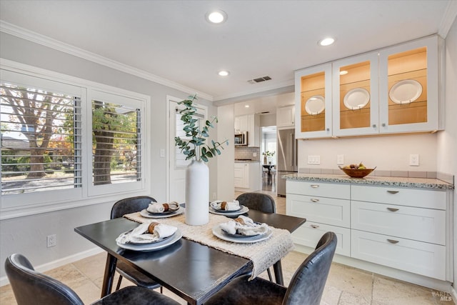 dining area featuring stone tile floors, recessed lighting, ornamental molding, baseboards, and visible vents