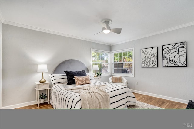 bedroom with baseboards, ornamental molding, and wood finished floors