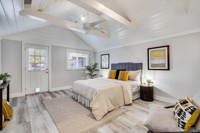 bedroom featuring vaulted ceiling with beams, wood finished floors, ceiling fan, and baseboards