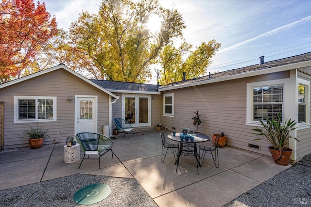 back of property featuring french doors and a patio area