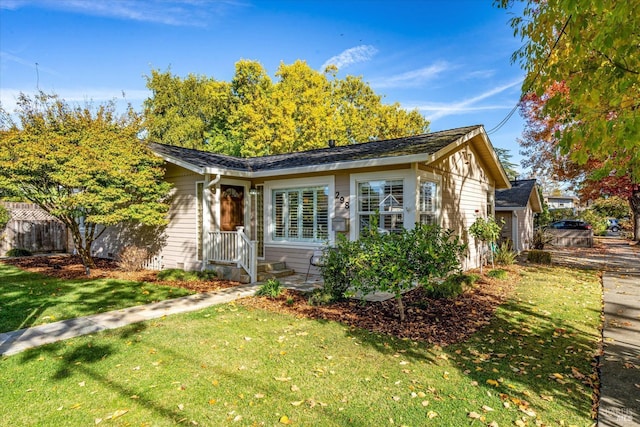 view of front of house featuring a front yard and fence