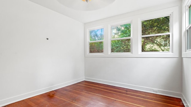 spare room featuring dark hardwood / wood-style flooring