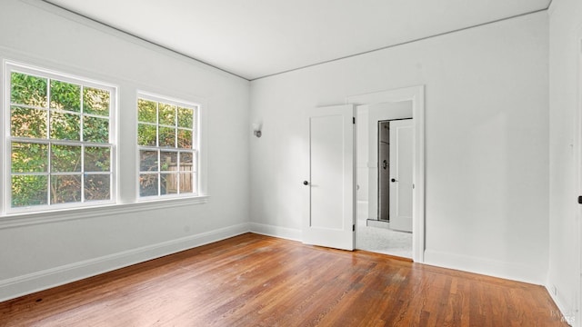 empty room with wood-type flooring