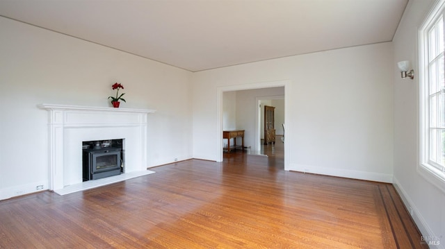 unfurnished living room with wood-type flooring