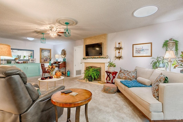 20 Meadowgreen Cir, Santa Rosa, CA 95409 - carpeted living room with a textured ceiling, ceiling fan, and a fireplace
