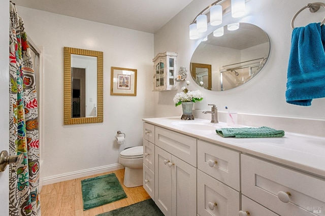 20 Meadowgreen Cir, Santa Rosa, CA 95409 - bathroom with toilet, a shower with curtain, vanity, wood finished floors, and baseboards