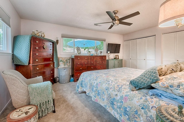 20 Meadowgreen Cir, Santa Rosa, CA 95409 - bedroom featuring carpet floors, two closets, and a ceiling fan