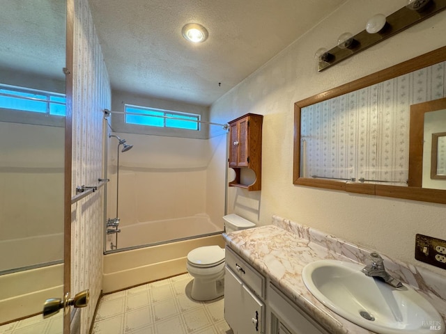 full bathroom with shower / washtub combination, a wealth of natural light, vanity, and a textured ceiling