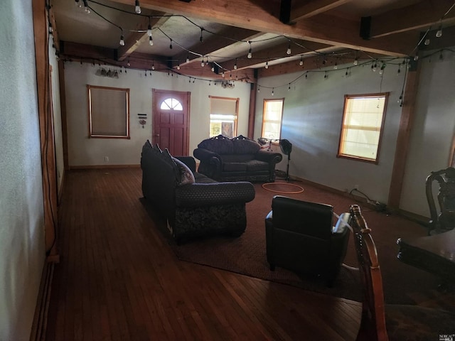 living room featuring wood-type flooring and beam ceiling