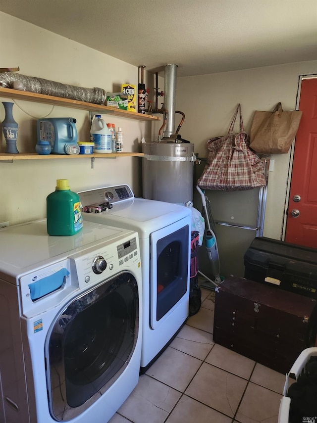 laundry room with independent washer and dryer, gas water heater, and light tile patterned flooring