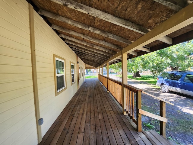 wooden terrace featuring a porch