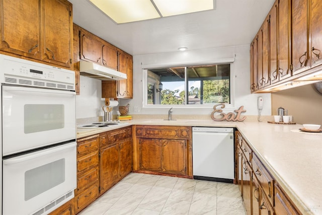 kitchen with sink and white appliances