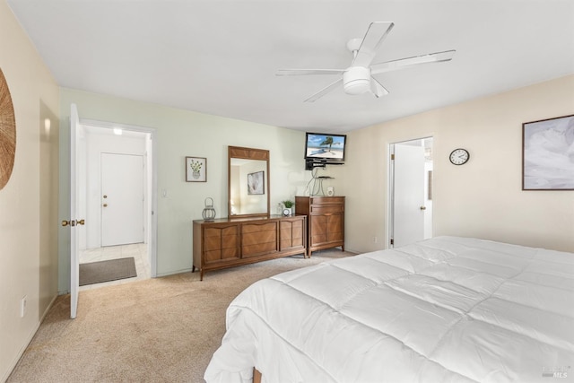 bedroom featuring ceiling fan and light carpet