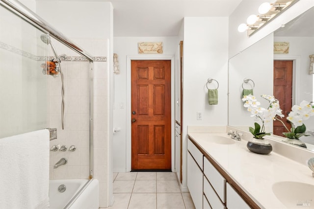 bathroom featuring vanity, shower / bath combination with glass door, and tile patterned floors