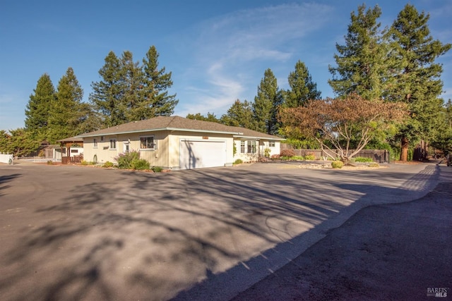 single story home with a garage