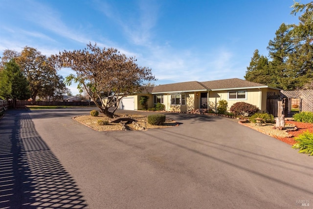 single story home featuring a garage