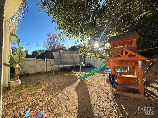 view of jungle gym featuring a trampoline