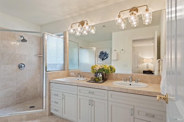 bathroom featuring vanity and a shower with shower door