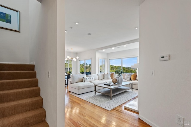 living room featuring hardwood / wood-style floors and a chandelier