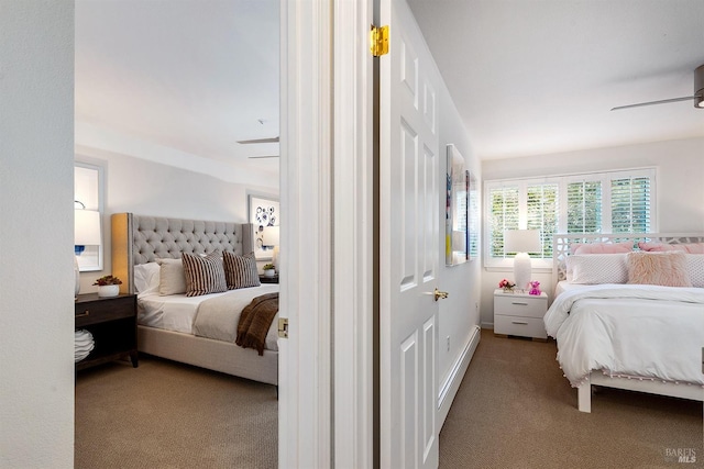 bedroom with baseboard heating, ceiling fan, and carpet flooring