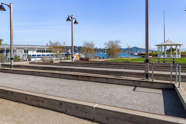 view of community featuring a gazebo and a water view