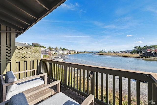 balcony featuring a water view