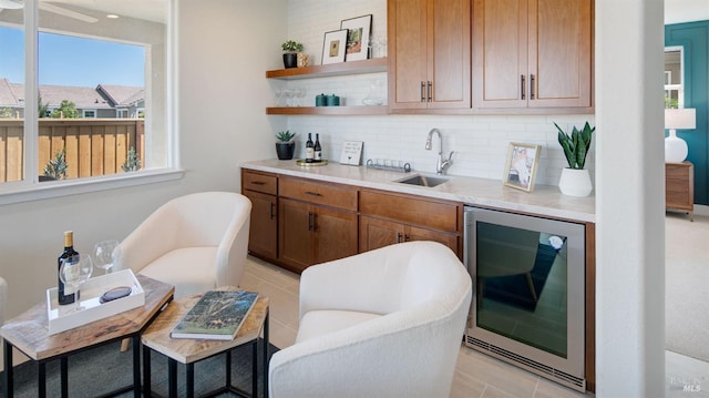 bar with backsplash, wine cooler, and sink