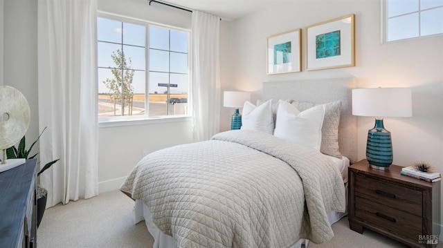 bedroom with light colored carpet