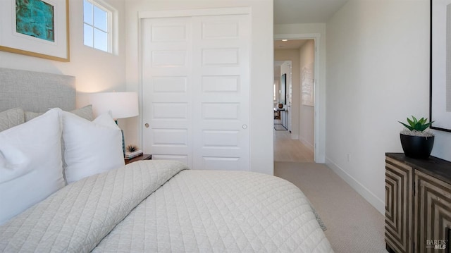 carpeted bedroom featuring a closet