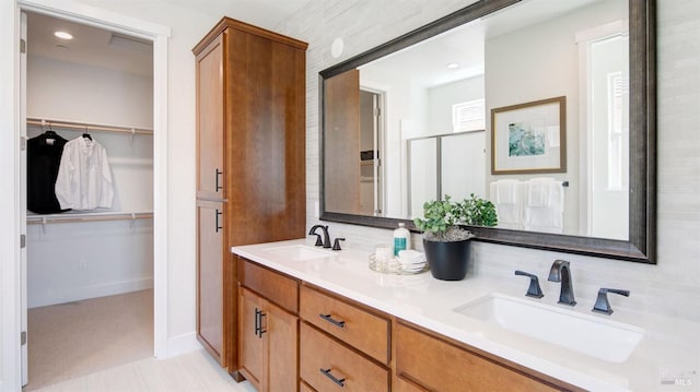 bathroom with vanity and an enclosed shower