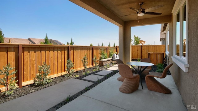 view of patio featuring ceiling fan