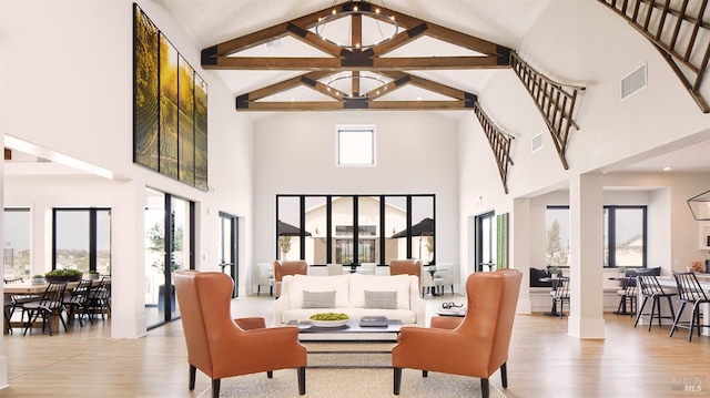 living room with light wood-type flooring and high vaulted ceiling