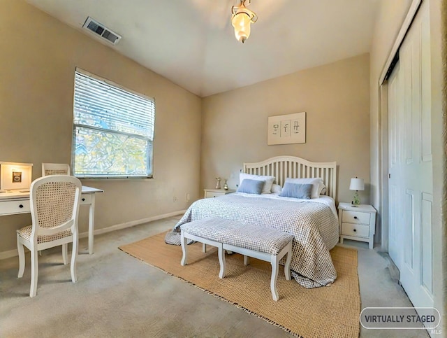 carpeted bedroom with a closet