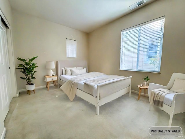 bedroom with light carpet