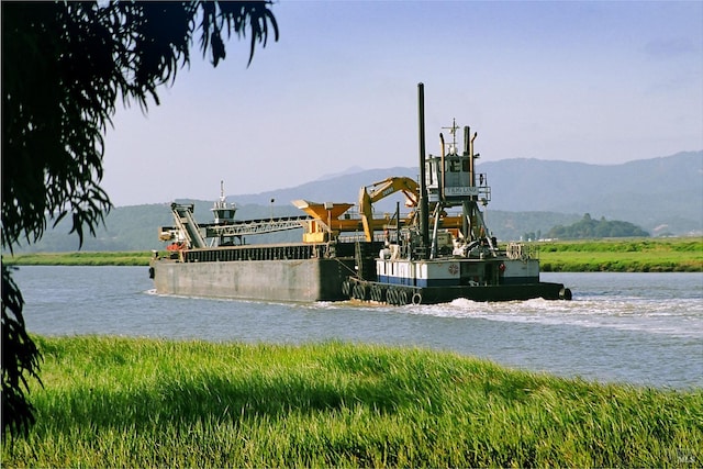 exterior space featuring a water and mountain view