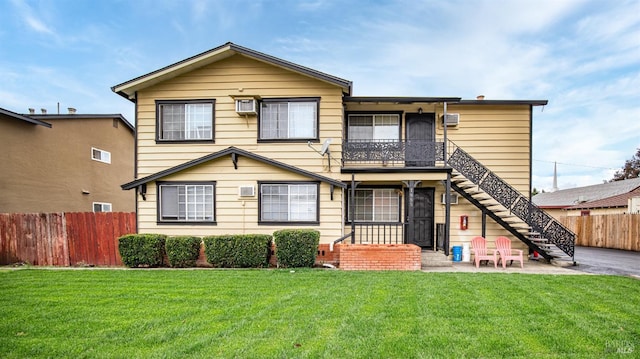 view of front of property with a patio area and a front yard