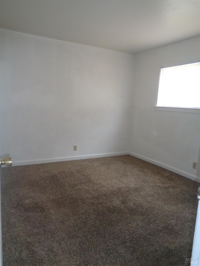 view of carpeted spare room