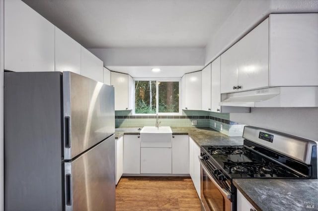 kitchen featuring sink, white cabinets, and stainless steel appliances