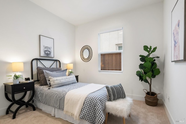 bedroom featuring light colored carpet