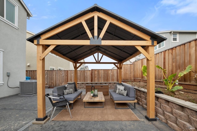 view of patio with a gazebo, outdoor lounge area, and central AC