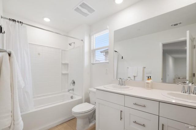 full bathroom featuring vanity, shower / tub combo, tile patterned floors, and toilet