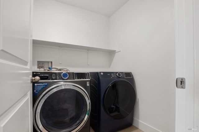 laundry area with washing machine and dryer