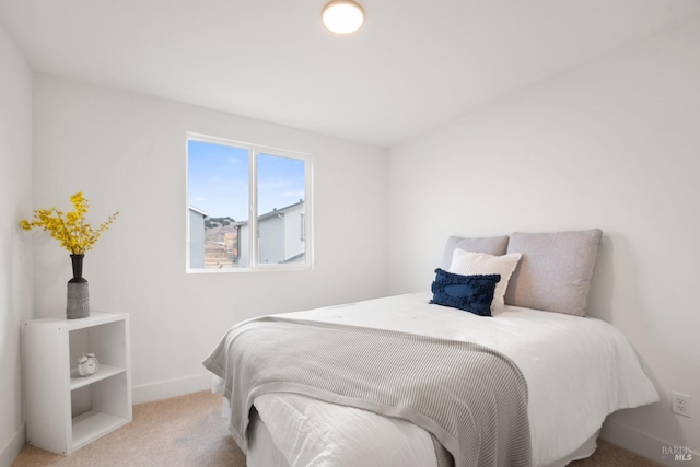 bedroom with light carpet