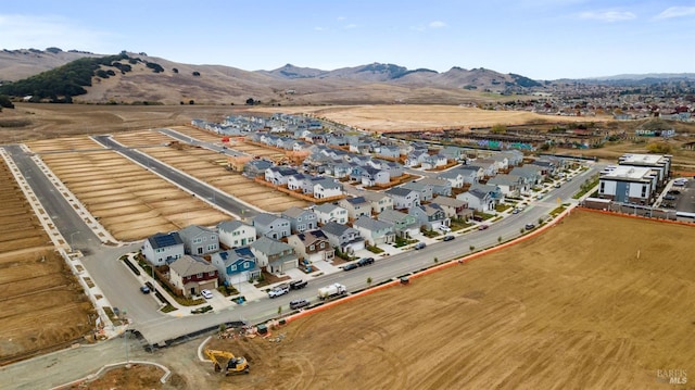 birds eye view of property with a mountain view