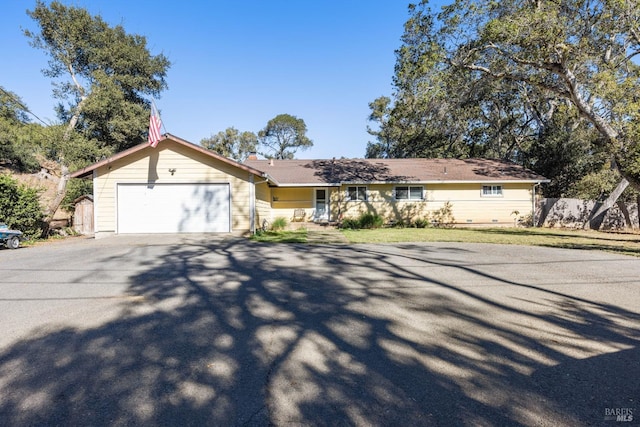 ranch-style home with a garage