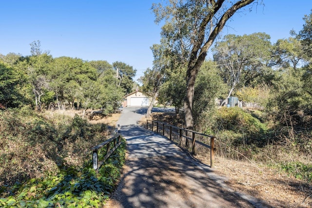 view of property's community featuring an outdoor structure