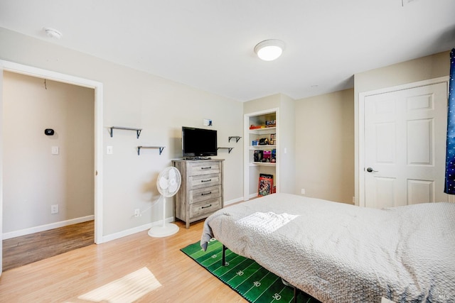 bedroom with hardwood / wood-style flooring